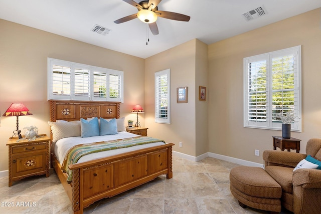 bedroom with visible vents, baseboards, and stone finish flooring