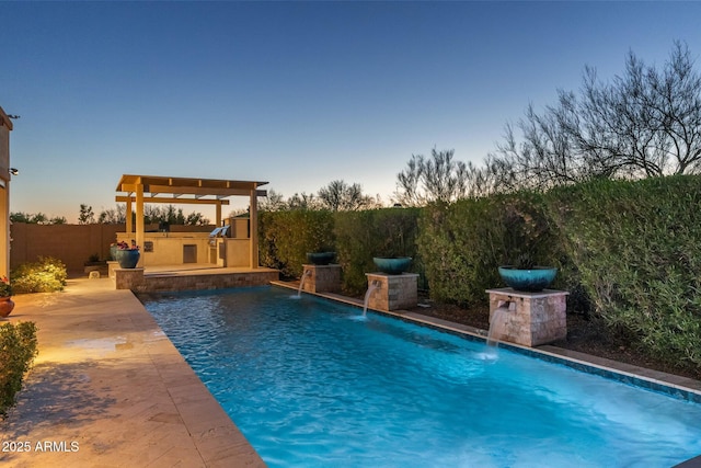 pool at dusk featuring a fenced backyard, a fenced in pool, and a patio area
