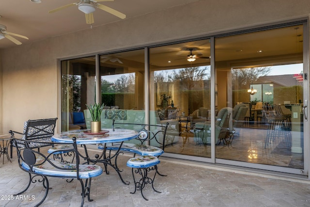 exterior space featuring outdoor dining space and ceiling fan