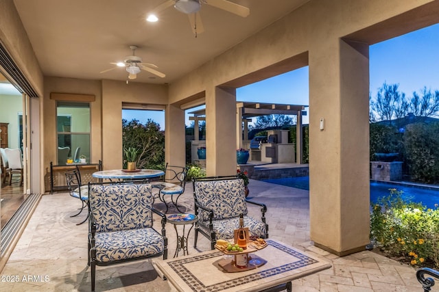 view of patio featuring area for grilling, a ceiling fan, outdoor dining area, and an outdoor pool