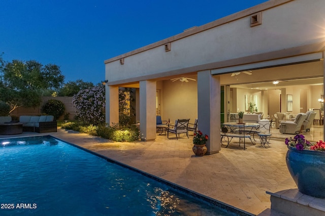 view of swimming pool with a fenced in pool, outdoor lounge area, and a patio