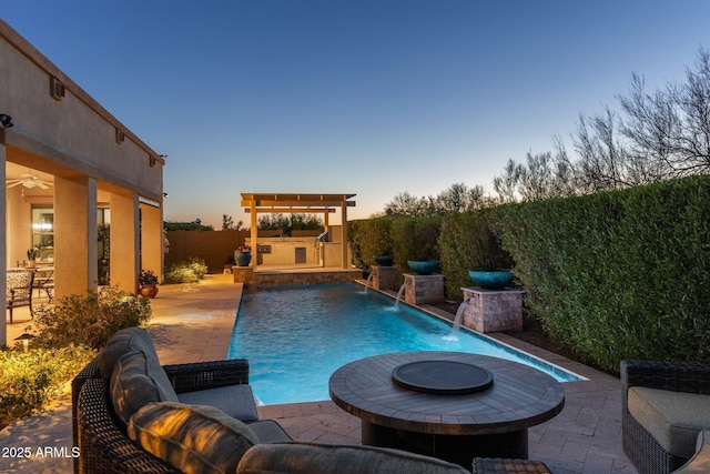 view of pool featuring a patio, a ceiling fan, and a fenced in pool