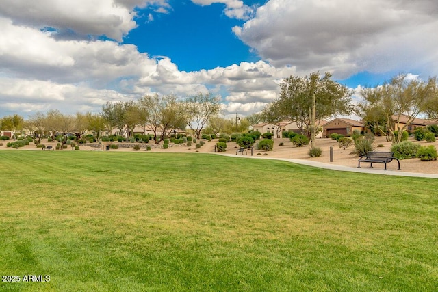 surrounding community with a residential view and a lawn