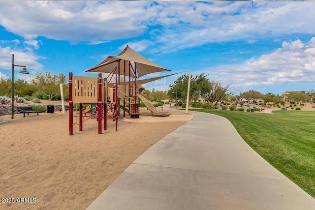 community jungle gym featuring a lawn