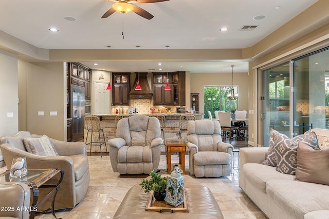 living room with recessed lighting, a ceiling fan, and visible vents