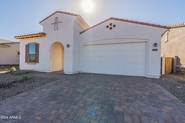 mediterranean / spanish-style house featuring a garage