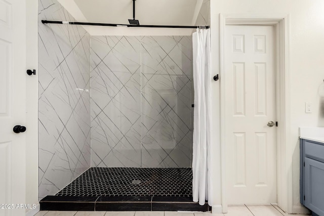 full bathroom featuring vanity, a shower stall, and tile patterned floors