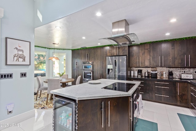 kitchen with island range hood, appliances with stainless steel finishes, decorative backsplash, wine cooler, and a center island