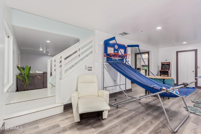 workout area featuring hardwood / wood-style floors