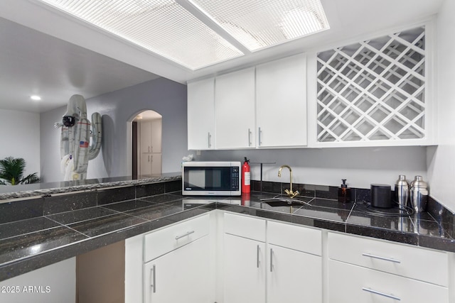 kitchen with sink and white cabinets