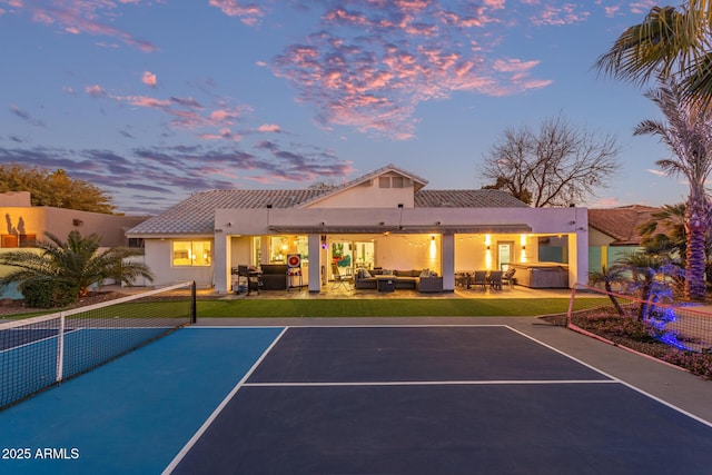 view of basketball court featuring tennis court