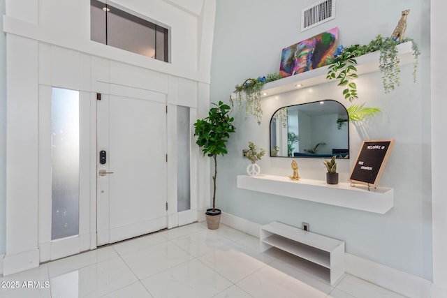 entryway with a towering ceiling