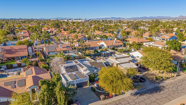 birds eye view of property with a mountain view