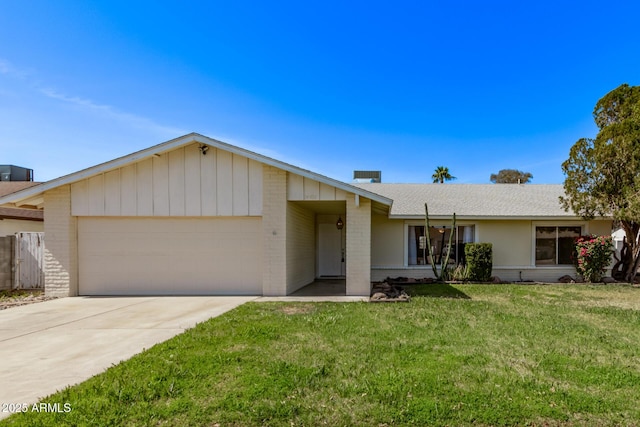 ranch-style house featuring a front lawn, concrete driveway, a shingled roof, a garage, and brick siding