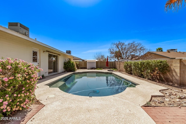 view of pool with a fenced backyard, a fenced in pool, a patio, and central AC