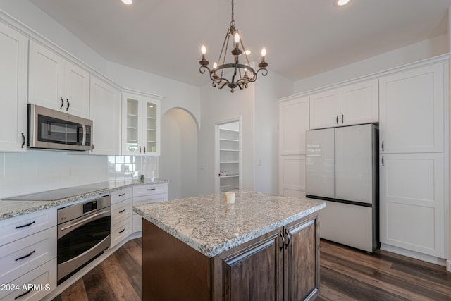 kitchen featuring white cabinetry, stainless steel appliances, and dark hardwood / wood-style flooring