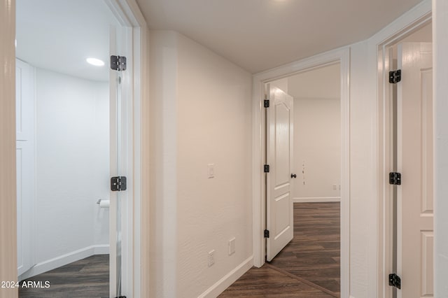 corridor featuring dark hardwood / wood-style flooring