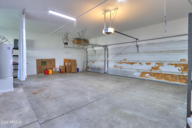 garage with a garage door opener and water heater