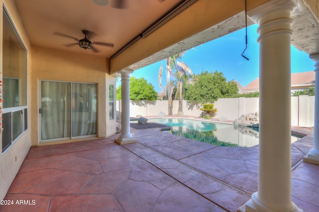 view of patio / terrace with ceiling fan and a fenced in pool