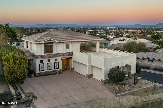 view of front of property featuring a mountain view and a garage