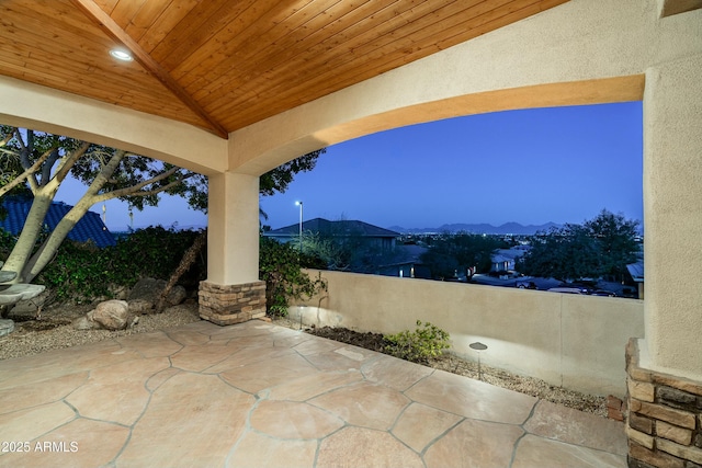 patio terrace at dusk with a mountain view