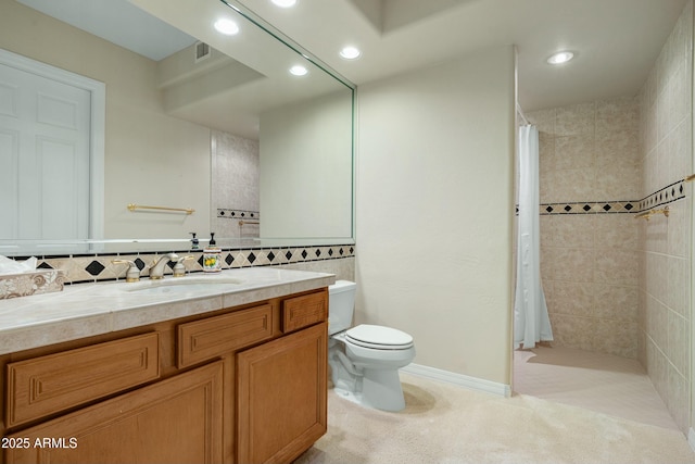 bathroom with toilet, decorative backsplash, vanity, and curtained shower