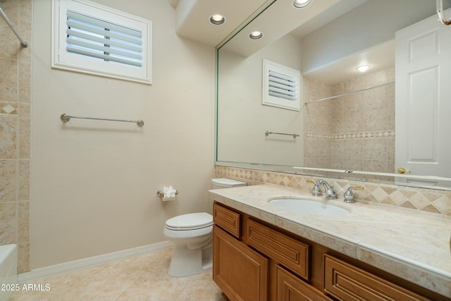 bathroom featuring toilet, tile patterned flooring, backsplash, and vanity