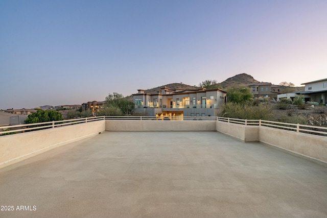 patio terrace at dusk with a mountain view