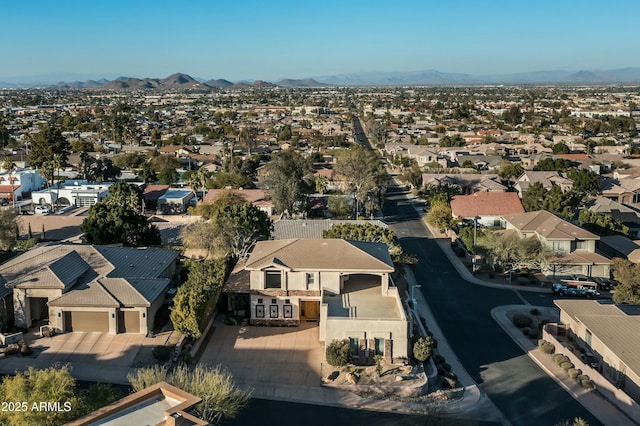 birds eye view of property featuring a mountain view