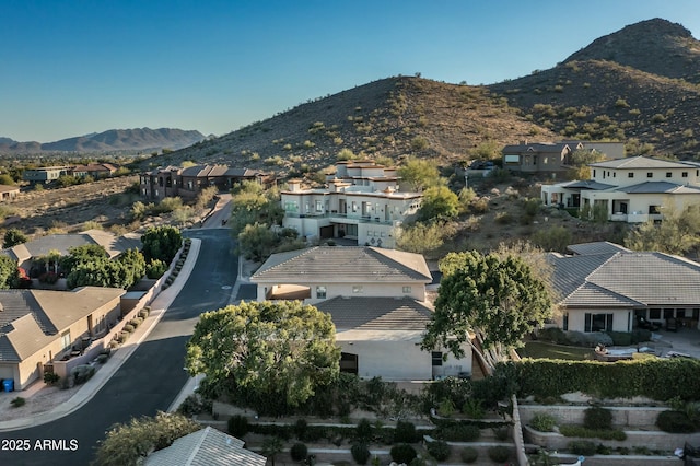 birds eye view of property with a mountain view