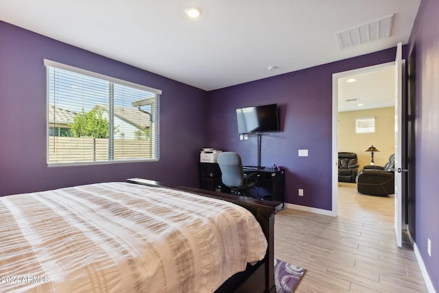 bedroom with light hardwood / wood-style flooring