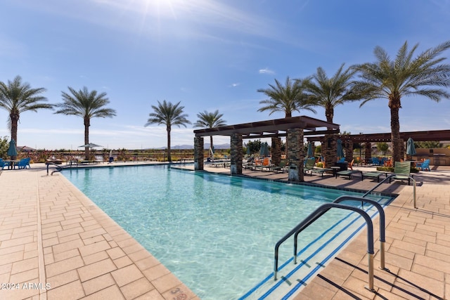 view of swimming pool featuring a patio area