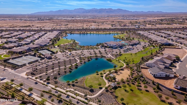 drone / aerial view featuring a water and mountain view