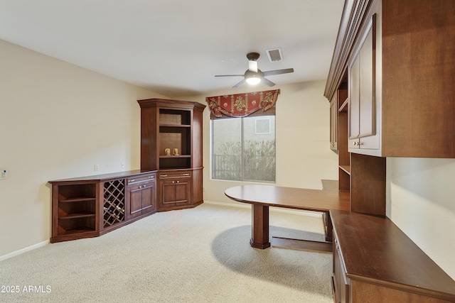 interior space featuring ceiling fan