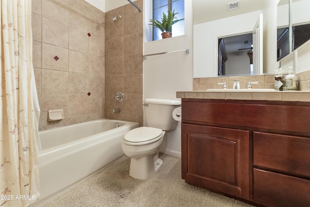 full bathroom featuring vanity, shower / bath combination with curtain, and toilet