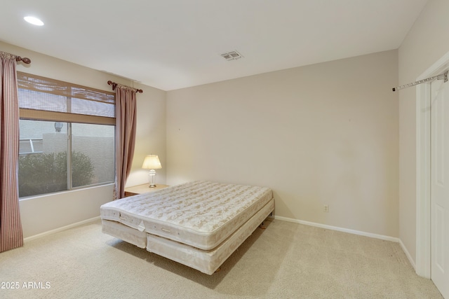 bedroom featuring light colored carpet