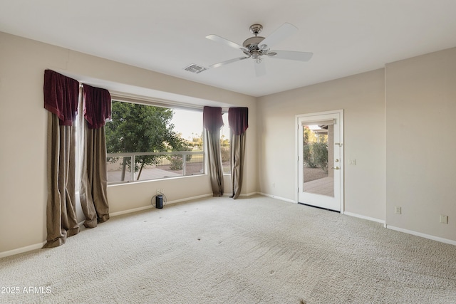 carpeted empty room with ceiling fan