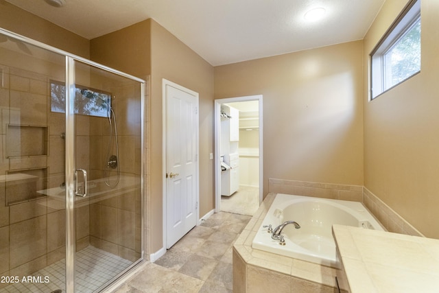 bathroom featuring independent shower and bath