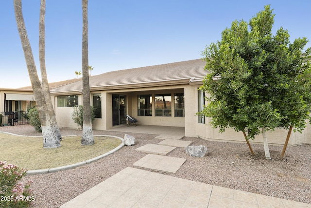 rear view of property with a patio area