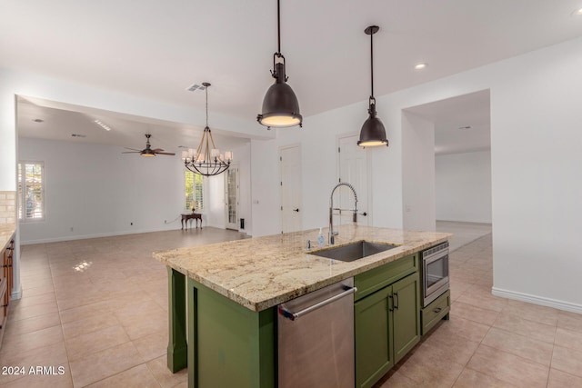 kitchen featuring a kitchen island with sink, sink, stainless steel appliances, and plenty of natural light