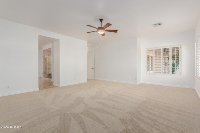 carpeted empty room with ceiling fan