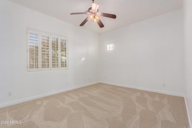 empty room with carpet and ceiling fan