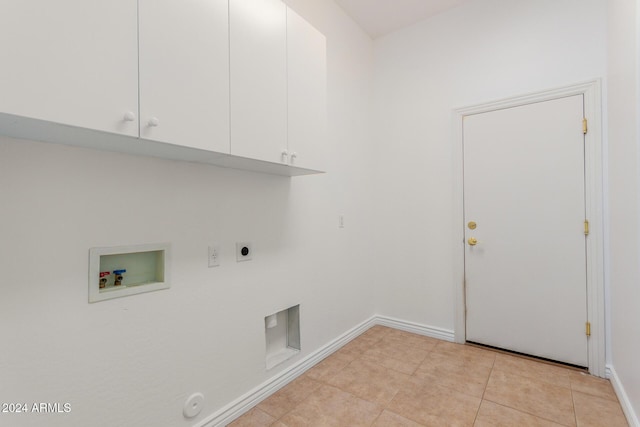 laundry room featuring cabinets, washer hookup, electric dryer hookup, light tile patterned floors, and hookup for a gas dryer