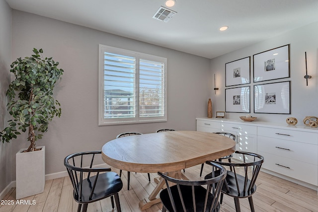 dining area with light wood-type flooring