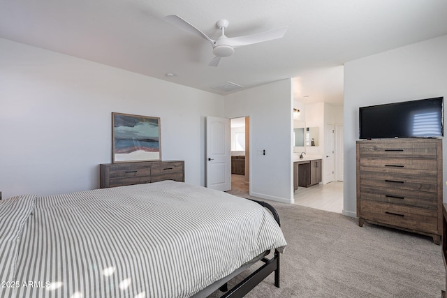 carpeted bedroom featuring ceiling fan and connected bathroom