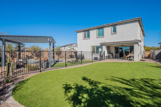 back of house featuring a pergola, a lawn, ceiling fan, and a patio area