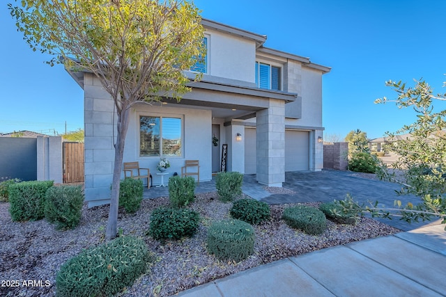 view of front of property with a garage and covered porch