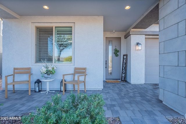 doorway to property with a patio