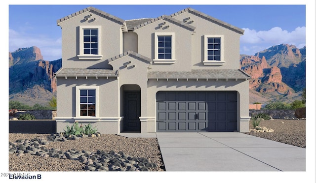 7327 W Buckhorn Trl, Peoria, AZ 85383 - view of front of property featuring a mountain view, concrete driveway, an attached garage, and stucco siding