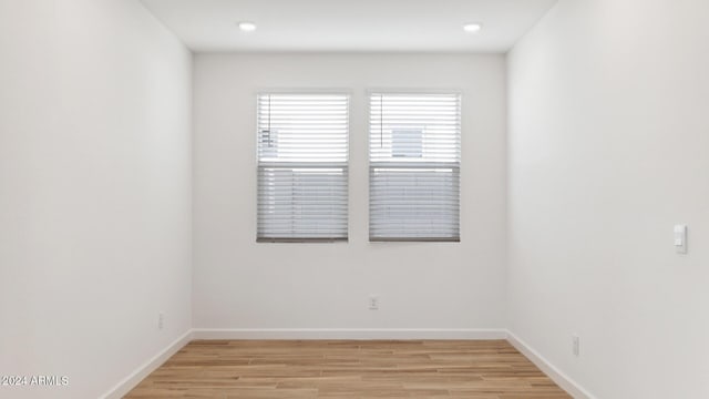 7327 W Buckhorn Trl, Peoria, AZ 85383 - empty room with light wood-style flooring, baseboards, and recessed lighting